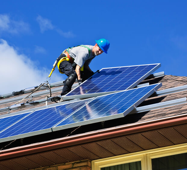 man installing solar panels daytona beach florida